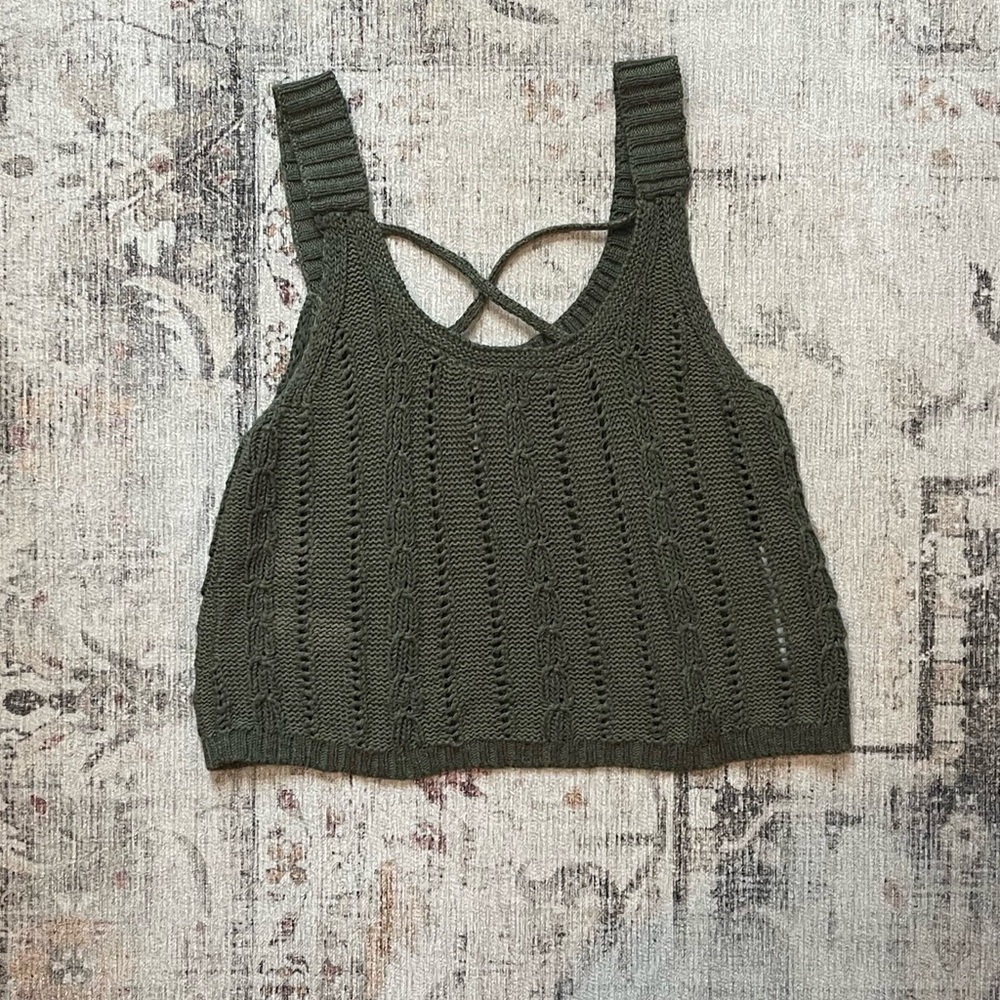 Green knit tank top with criss cross chest and a scoop neckline. #cropped #knit